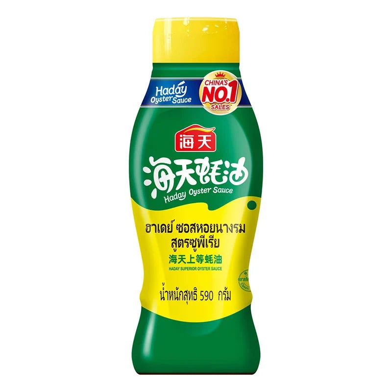 HADAY Oyster Sauce Superior 590g jar, with label visible, in a dry grocery setting, showcasing the product for cooking and flavoring.