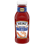 Heinz Seafood Cocktail Sauce bottle with label, placed on a grocery store shelf.
