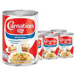 CARNATION evaporated milk 405g cans stacked in a box, ideal for baking and cooking, part of dry grocery essentials.