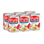 Carnation evaporated milk 405g cans stacked, ideal for baking and cooking, in a dry grocery product display