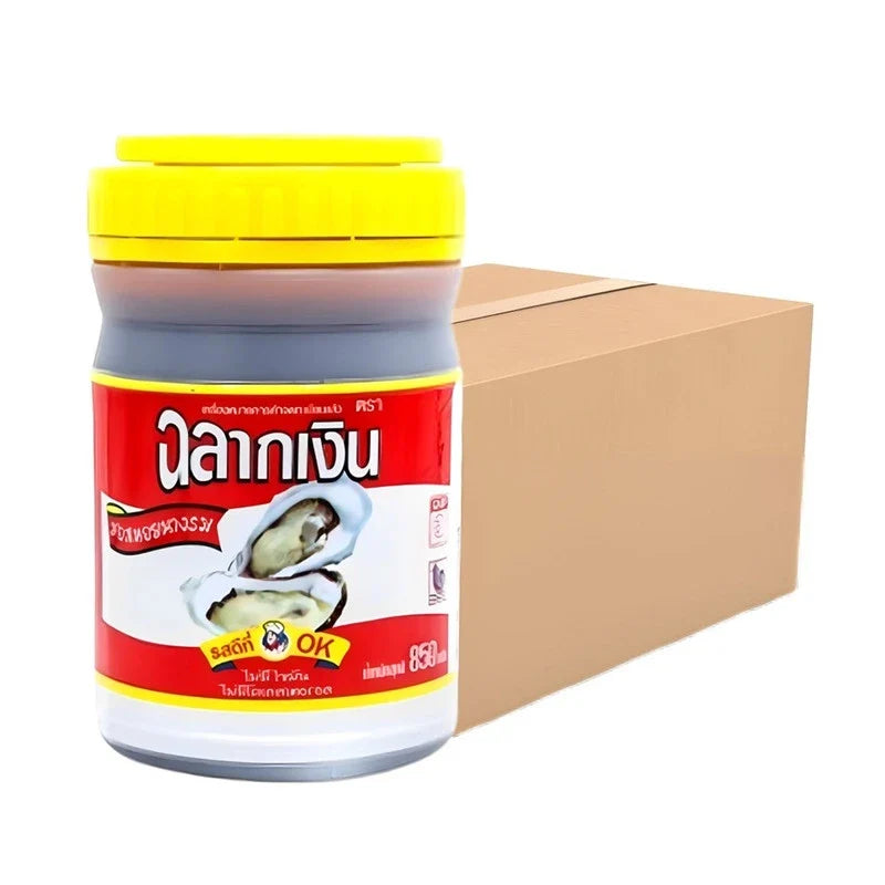 Chalarkngurn Oyster Sauce 850g jar, part of a 12-pack, in dry grocery section, showing the product label and jar lid.