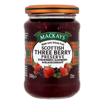 Mackay Three Berry Preserve jar with a spoon, showing the vibrant mixed berry spread and fresh berries on a white background.