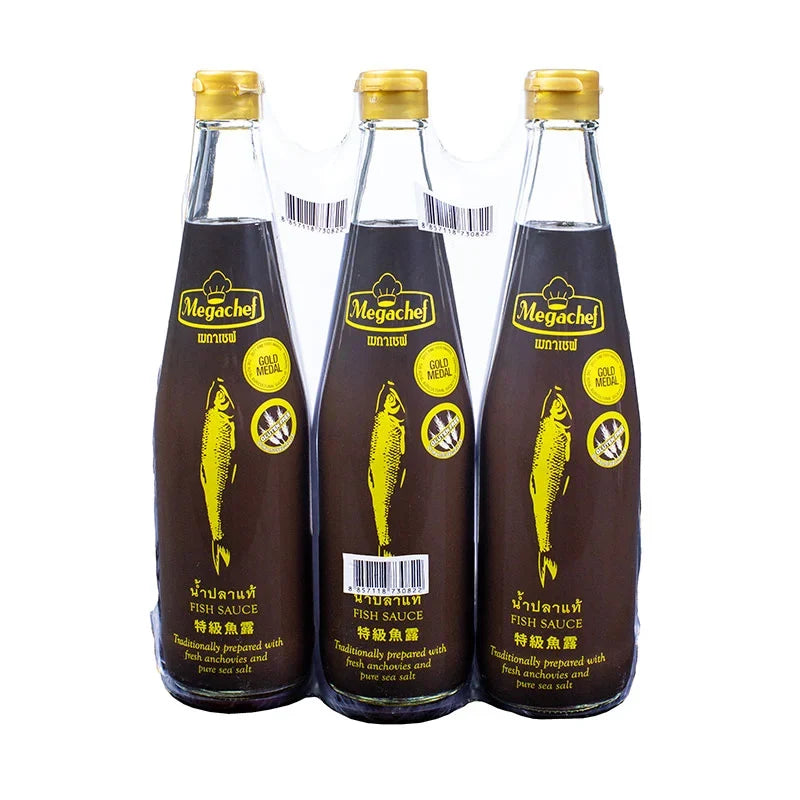 Three bottles of Megachef Fish Sauce 700ml in clear bottles with black caps, used for cooking and flavoring in Asian cuisine.