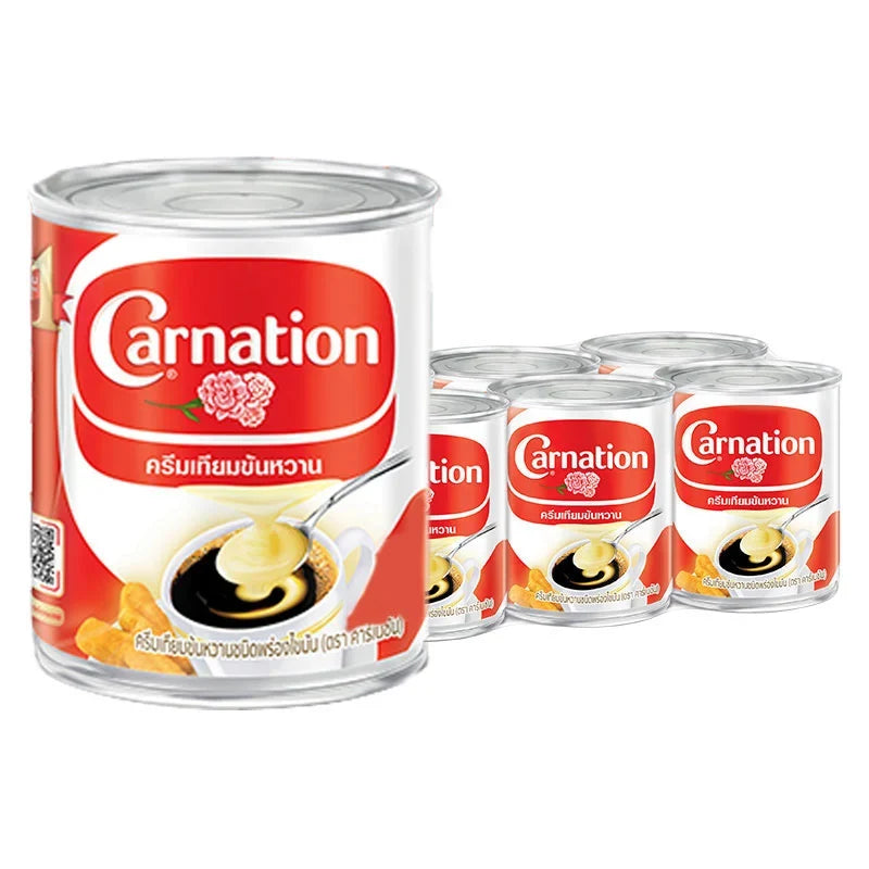 Carnation sweetened beverage creamer in 388g package, shown in six-pack dry grocery product image with creamy powder content.