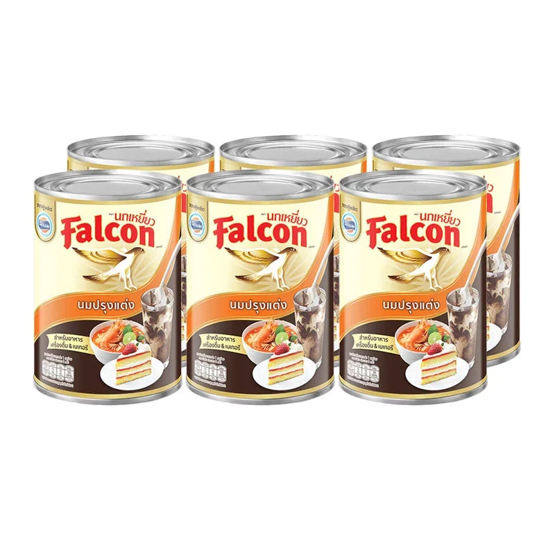 Falcon evaporated milk 375g cans, six-pack, dry grocery product with cans stacked side by side.
