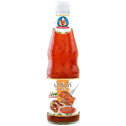 Deksomboon Sweet Chili Sauce 900g bottle from dry grocery section, showcasing the colorful label and sauce inside.