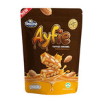 Nezline Nuts Crisp snack in a clear bowl, showing crunchy nut-filled confectionery pieces with caramel coating.