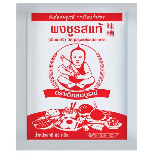 Deksomboon MSG 85g container for cooking, labeled as dry grocery seasoning, with a clear view of the product packaging.