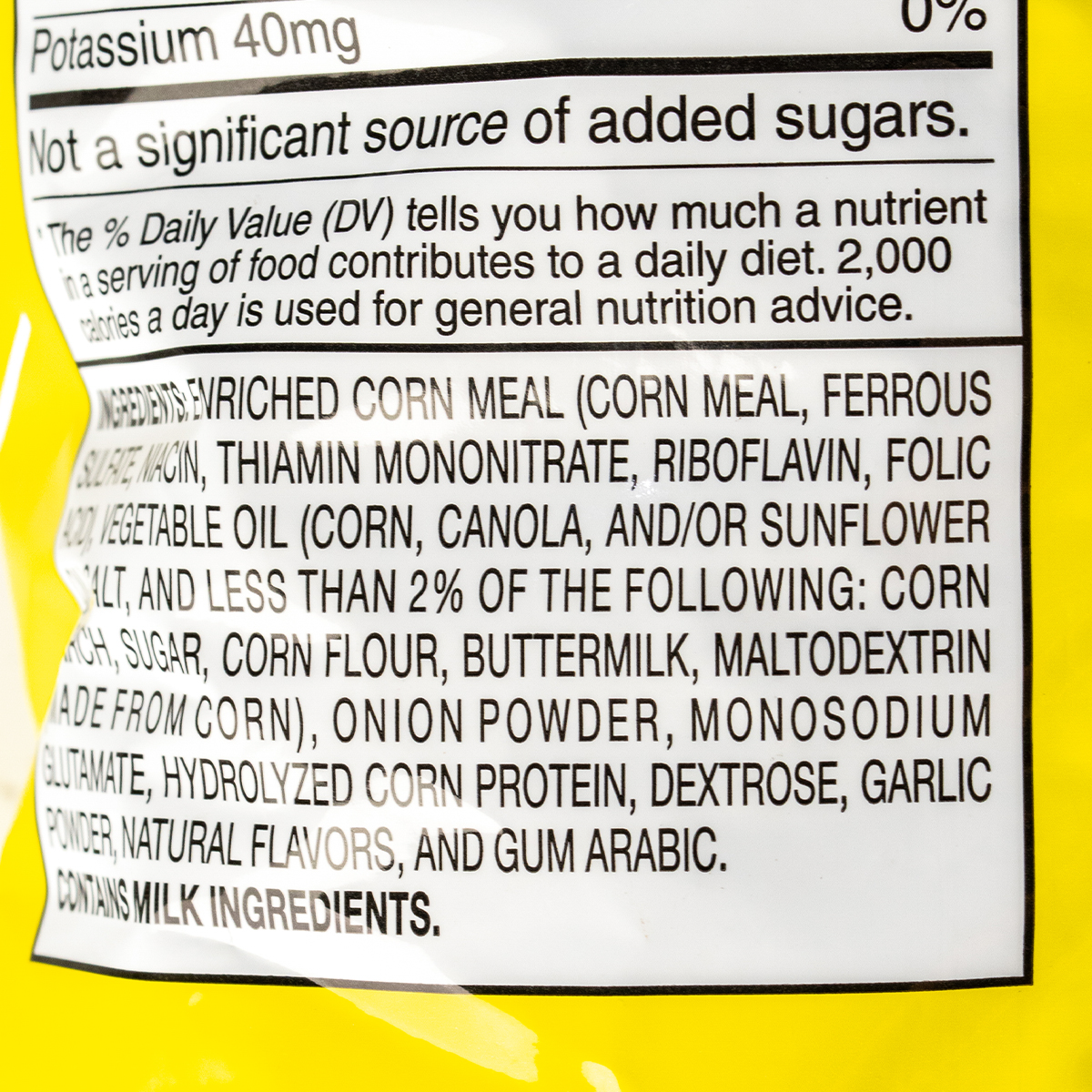 Plate of Funyuns onion-flavored rings, crispy confectionery snacks with a crunchy texture and savory onion taste.