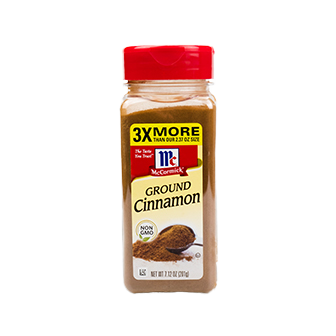 Ground cinnamon spice in a jar from McCormick, showing the spice's rich brown color and label on the container.