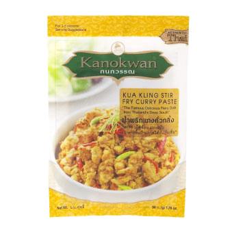 Kanokwan Kua Kling stir fry curry paste in a jar, showcasing the Thai spice blend with red chili and aromatic herbs.