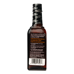 Wright Mesquite Liquid Smoke bottle for grilling and cooking, showcasing the grocery product with a clear view of the label.