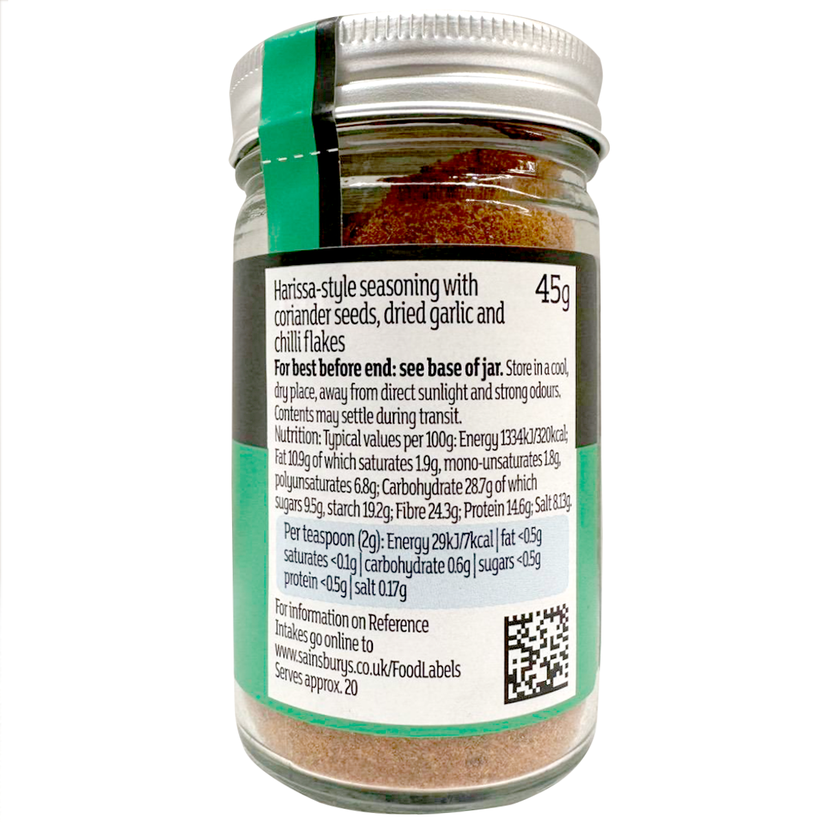 Sainsbury's Itc Harissa spices in a clear jar, showcasing vibrant red chili powder and spice blend for cooking.