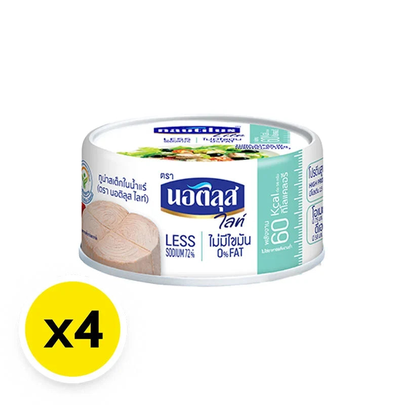 Cans of Nautilus Lite Tuna Steak in spring water, 165g x4, dry grocery product with the tuna visible in sealed cans.