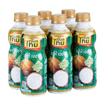 Six bottles of REAL THAI Coconut Milk in 250ml PET containers, displayed in a dry grocery setting.