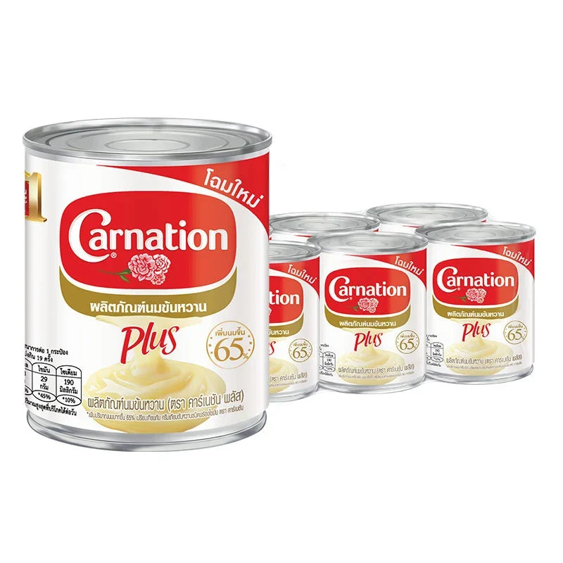 Carnation Plus sweetened condensed milk 380g can, stacked in a six-pack, with the product label visible on the cans.