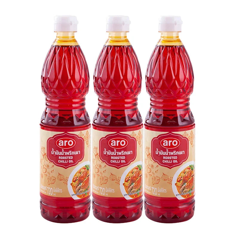 Three bottles of ARO Fried Curry Paste Oil, 720ml each, in clear plastic bottles with yellow caps, ready for cooking.
