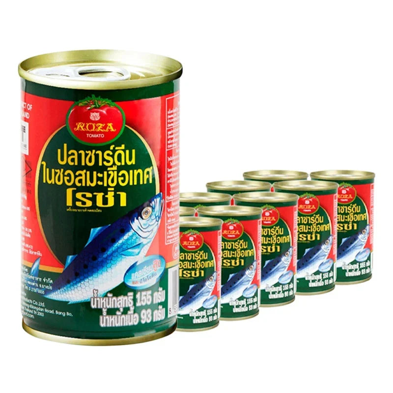 Cans of Roza Sardines in Tomato Sauce 155g, stacked in a box, part of dry grocery seafood collection.