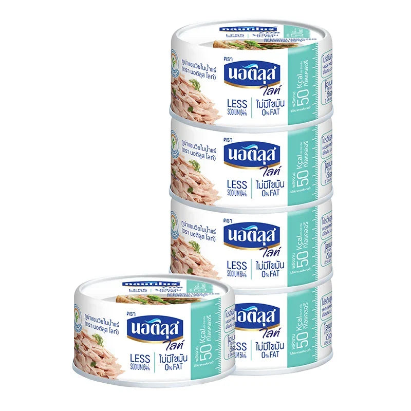 Cans of Nautilus Lite Tuna Sandwich in spring water, 165g each, arranged in a row for dry grocery shopping.