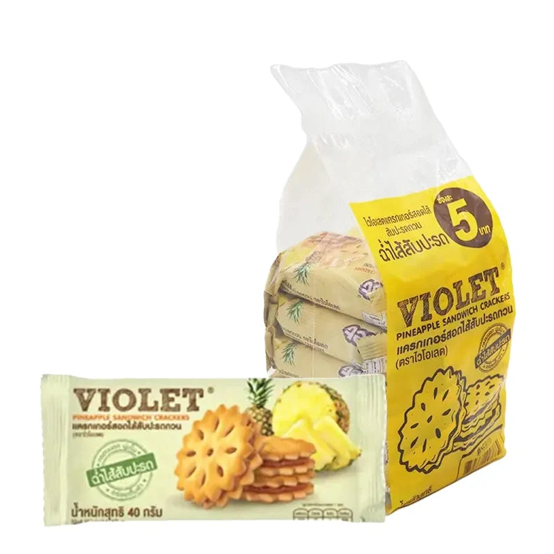 Violet Cracker Pineapple 32 snack pack, dry grocery confectionery with pineapple flavor, in a colorful packaging.
