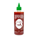J-LEK Sriracha Chili Sauce spicy formula bottle, 455ml, with red chili peppers and sauce visible in clear packaging.