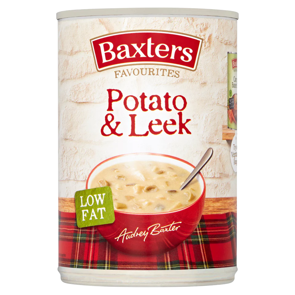 Baxters Potato and Leek Soup in a bowl, showcasing a creamy, green and white soup with leek and potato pieces, in a grocery setting.