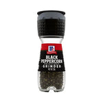 Mccormick Black Pepper 28g container, dry grocery spice jar with black peppercorns and label.