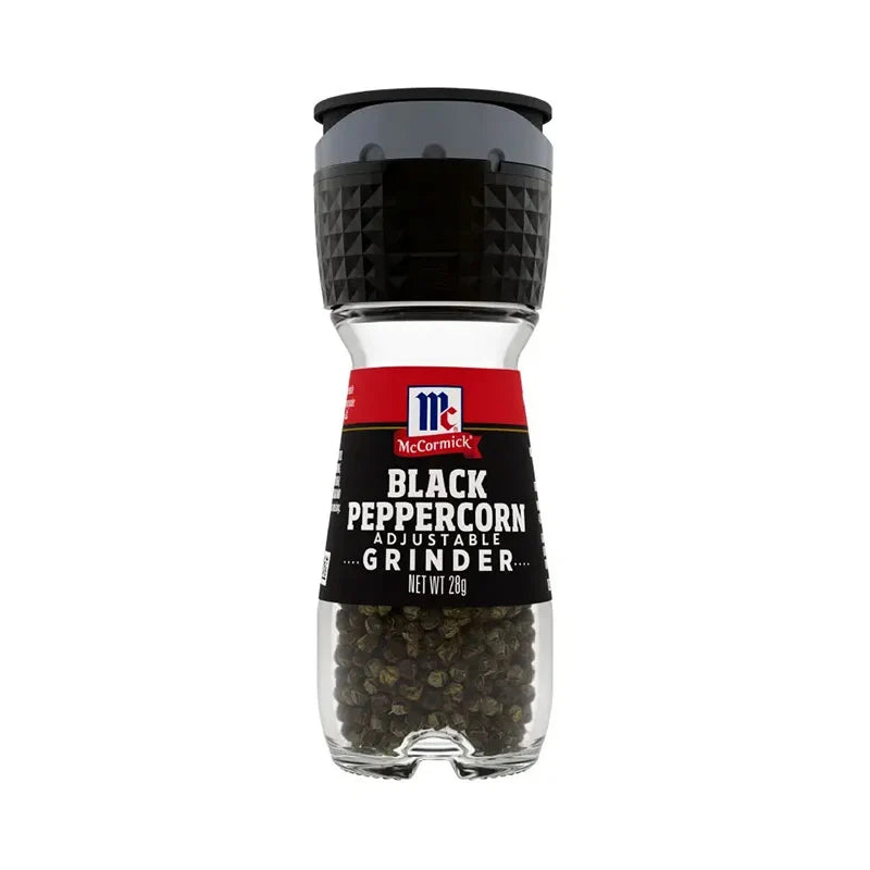 Mccormick Black Pepper 28g container, dry grocery spice jar with black peppercorns and label.