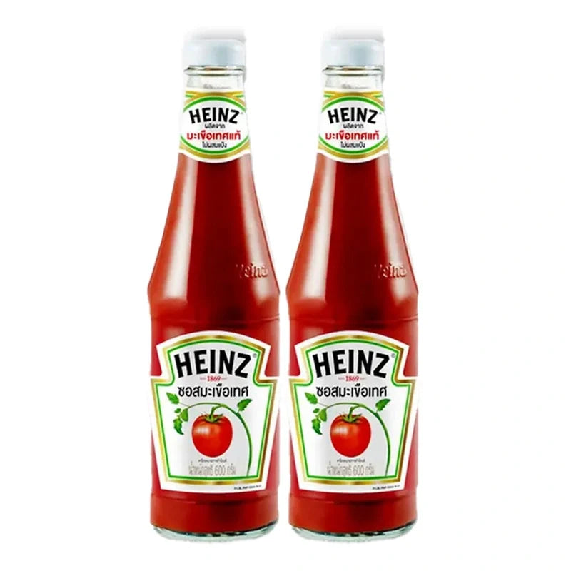 Heinz Tomato Sauce 600g bottles, shown in a pack of two, for dry grocery use, with red ketchup and Heinz branding.