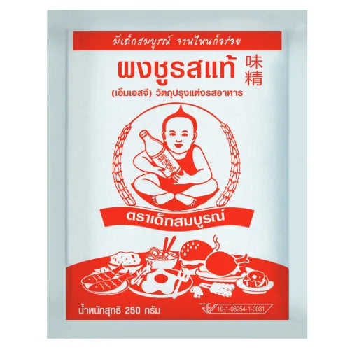 Deksomboon MSG 250g jar, a dry grocery seasoning with a clear label, displayed in a kitchen setting.