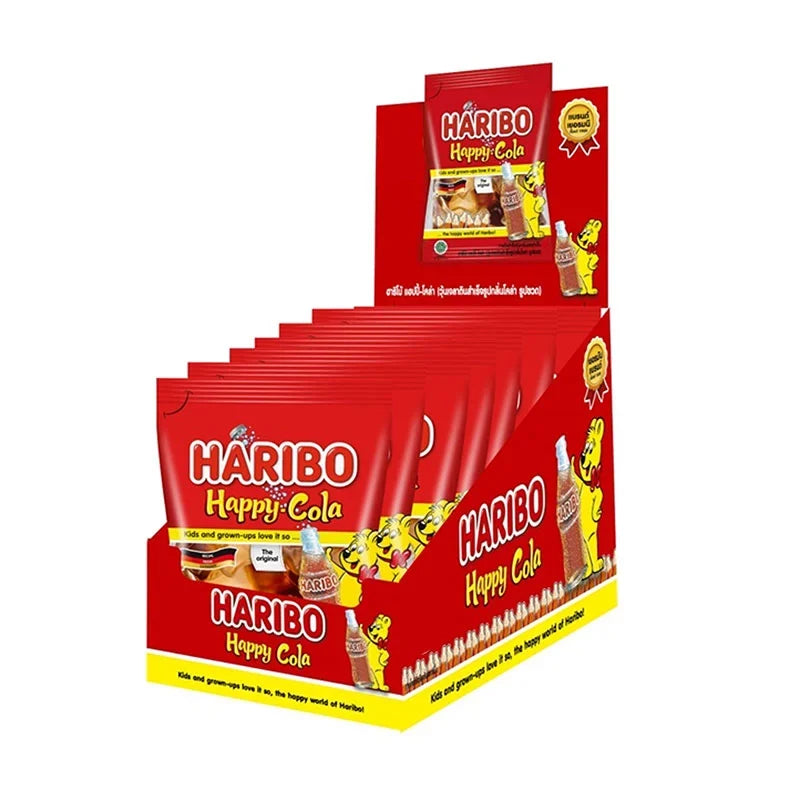 Haribo Gummy Happy Cola candies in 14g packs, colorful cola-flavored gummy snacks, display of multiple packs on a white background.