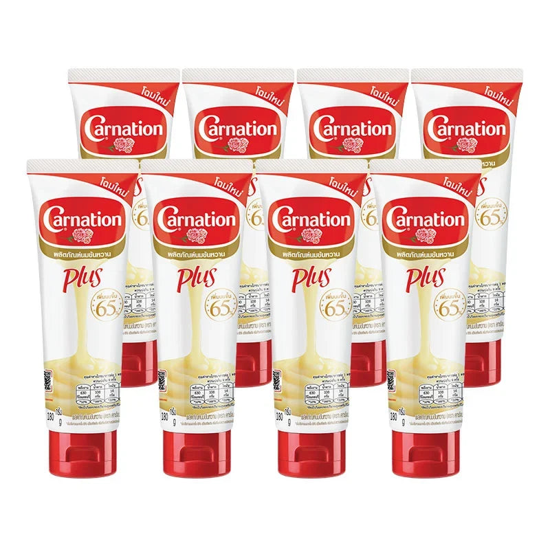 CARNATION Carnation Plus sweetened condensed milk tube, 180g, stacked in a pack of eight for baking and desserts.