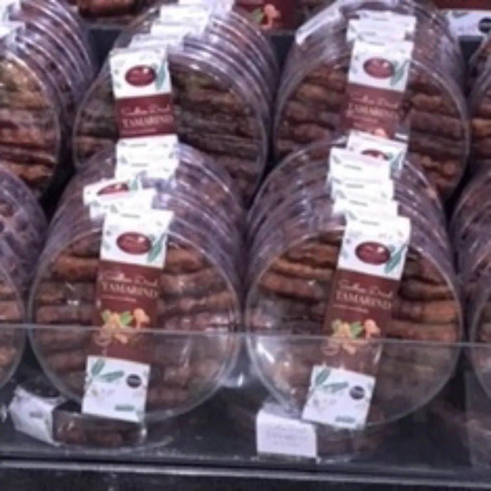 Sriwanna seedless dried sweet tamarind in 140g package, showing glossy, dark brown tamarind pieces on a white background.