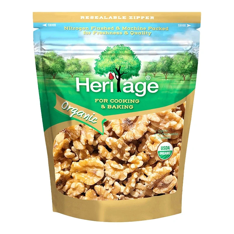 Heritage Organic Raw Walnuts in a 200g package, close-up of whole walnuts with textured shells in a dry grocery setting.