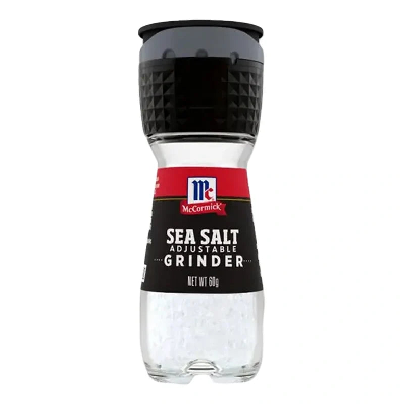 Mccormick Sea Salt Grinder 60g with black plastic body and clear window showing coarse sea salt inside, used for seasoning.