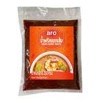 ARO Sour Curry Paste 250g in a clear jar, showcasing yellowish dry curry paste with a smooth texture, for Asian cooking.