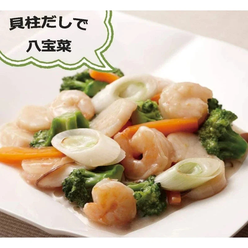 Youki Kaibashira soup stock granule with scallop extract, dry seasoning for cooking, in a clear container.