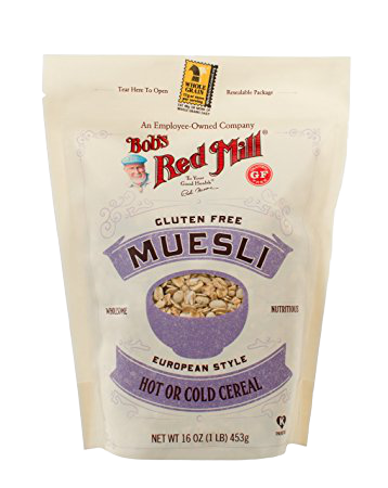 A bowl of Bob's Red Mill gluten-free muesli with oats, nuts, and dried fruit, showcasing a healthy breakfast option.