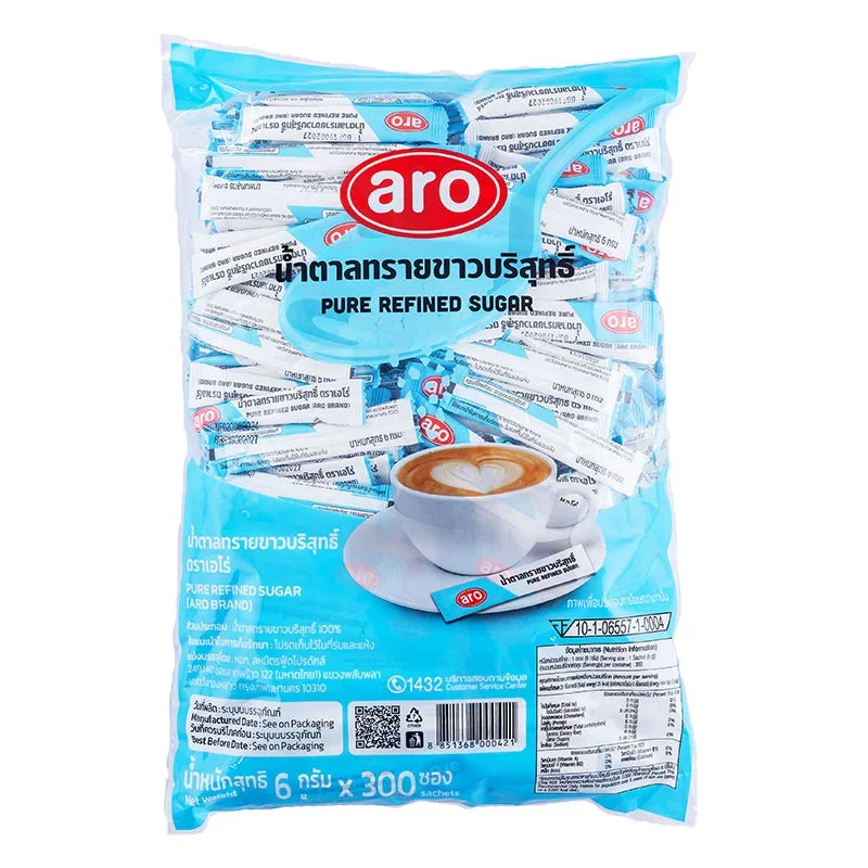 Close-up of ARO Stick Pure Refined Sugar 6g packet, showing the product label and packaging for dry grocery use.
