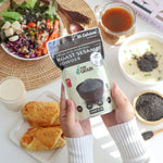 Pure Grain 100% ground roasted sesame seeds in 80g pack, dry grocery product, showing the sesame seed texture and packaging.