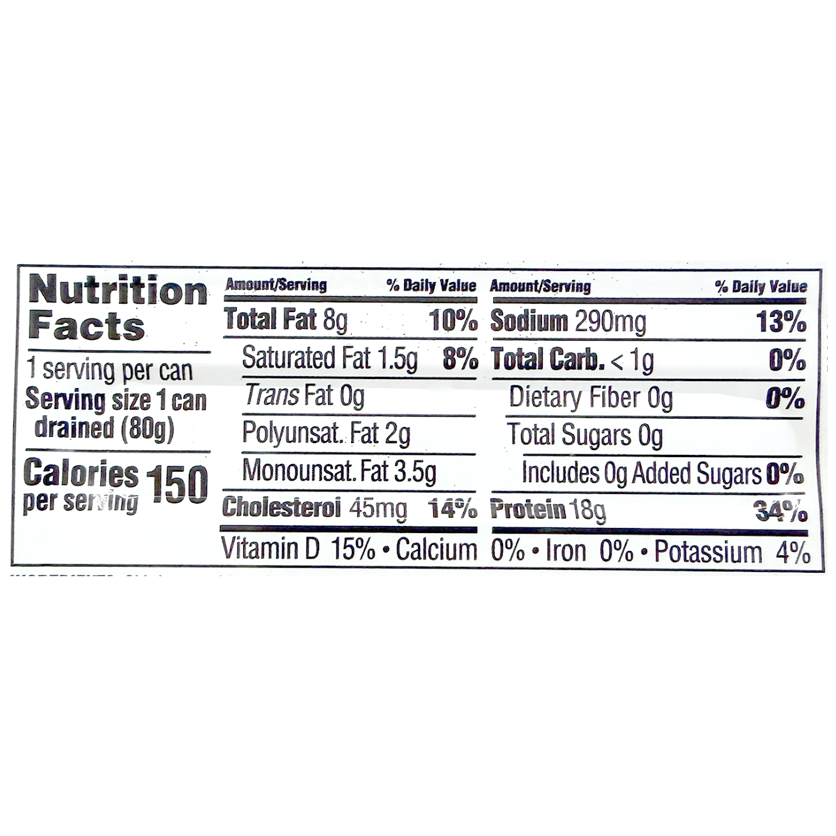 Canned King Oscar salmon in olive oil with flakes visible, showcasing high-quality seafood in a grocery product image.