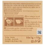 A cup of Twining's Pure Camomile herbal tea in a white mug with dried camomile flowers and tea bag tags visible.