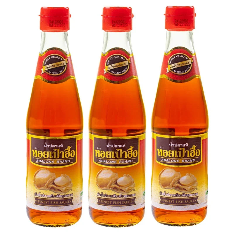 Three bottles of Abalone Premium Fish Sauce in 300ml bottles, featuring clear labels and dark soy-colored liquid inside.