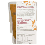 A bowl of The Spice Tailor Classic Butter Chicken sauce with spices and ingredients on a rustic wooden table.