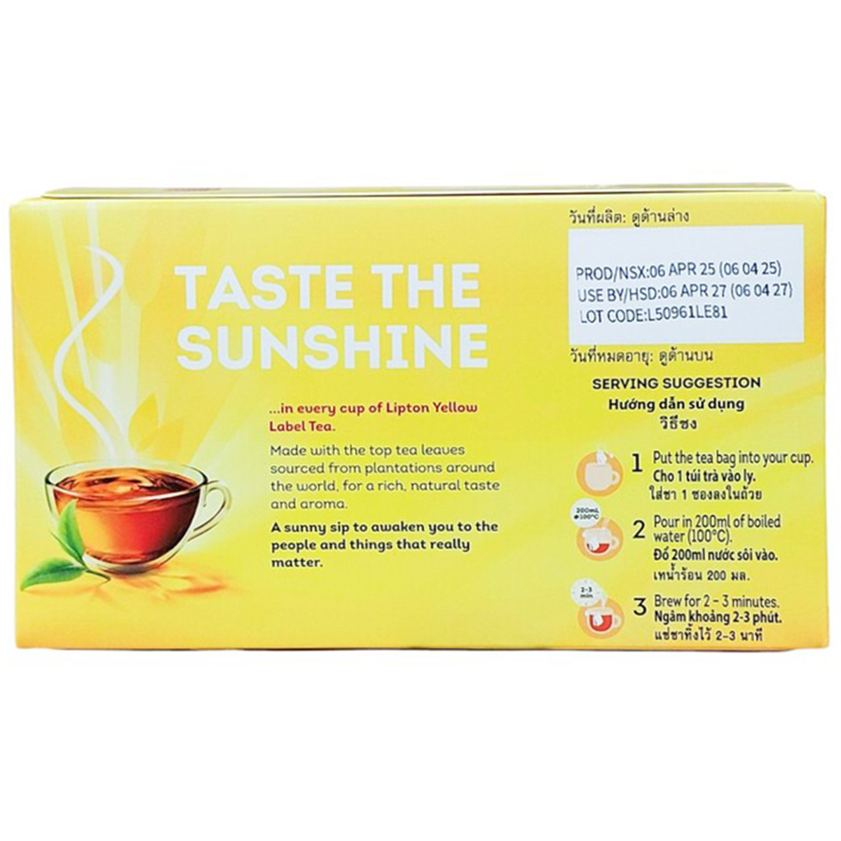 Box of Lipton Yellow Label Tea Bags with tea infuser and steaming cup of brewed tea on a wooden table.