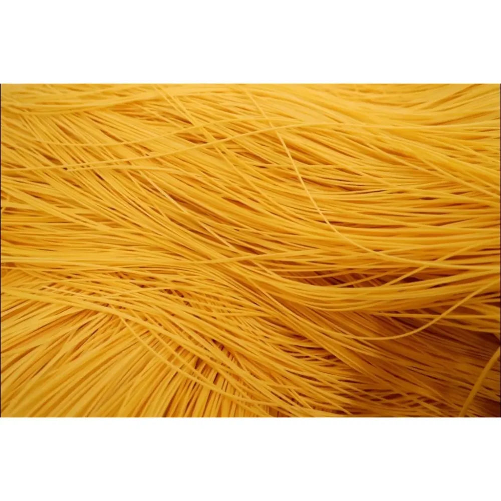 Dry grocery image of Rabbit Brand Yellow Chinese Noodles, 1kg package, showcasing the bright yellow noodles ready for cooking.
