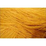 Dry grocery image of Rabbit Brand Yellow Chinese Noodles, 1kg package, showcasing the bright yellow noodles ready for cooking.
