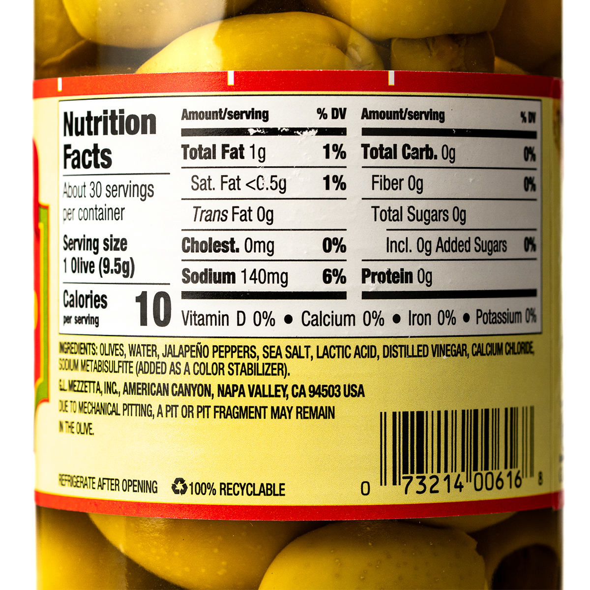 Mezzetta jalapeno stuffed olives in a clear bowl, showcasing green olives filled with spicy jalapeno peppers for healthy snacking.