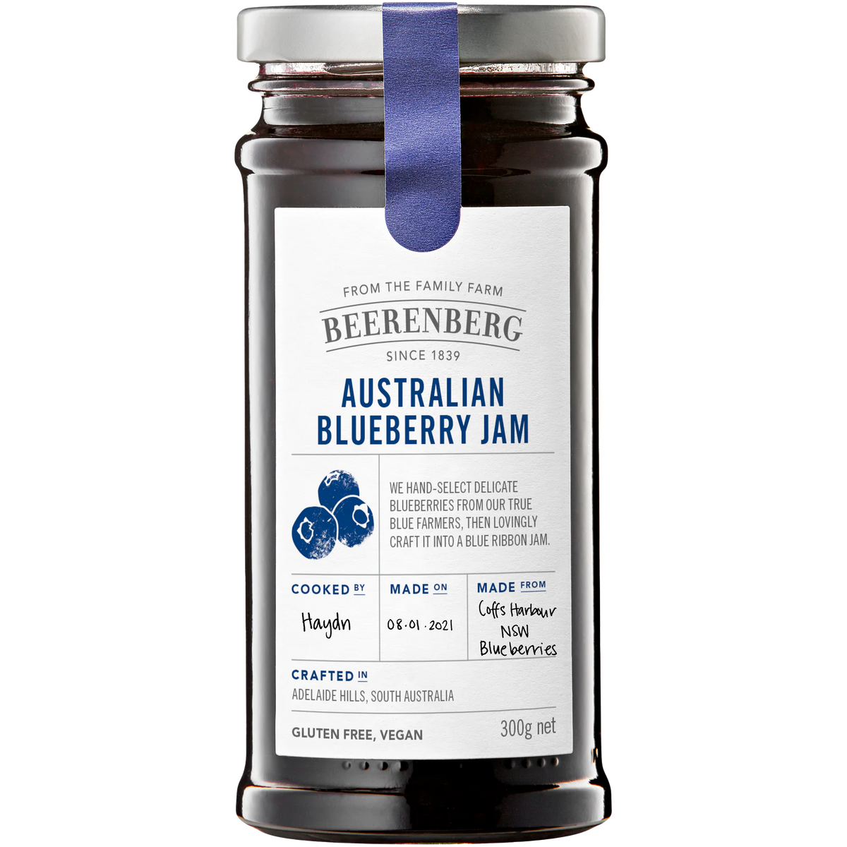 Beerenberg Blueberry Jam jar showing a close-up of the jam with fresh blueberries in the background.