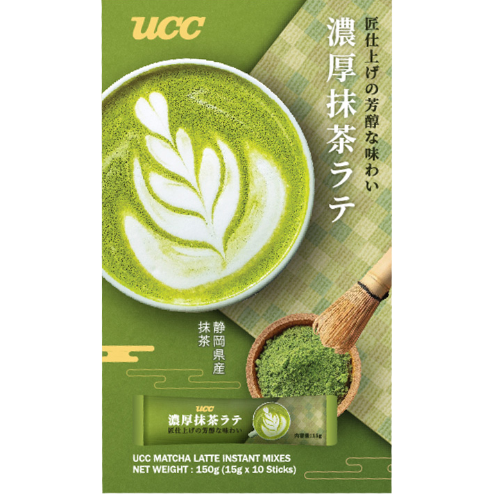 Ucc Matcha Latte drink in a glass with frothy green matcha topping and creamy milk, served in a clear glass.